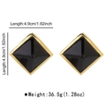 Detail view of 4.9cm geometric square pyramid earrings with gold trim and black resin center - Black