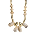 Detail of bohemian acrylic marbled beads and gold plated metal drops on a necklace - Off White