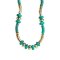 Bohemian beaded necklace with turquoise stones and textured gold metal tubes on white background - N12982