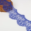 Detailed view of royal blue eyelash lace trim with intricate floral embroidery patterns - Sapphire Blue