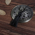 Antique bronze hollow-out pendant with intricate dragon phoenix pattern and black silk tassel - Black