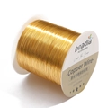 Detailed view of 0.3mm golden jewelry copper wire wound on a white plastic spool - Thickness 0.5mm approx 110m/roll / KC Gold