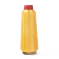 Bobine de fil à broder métallique jaune vif sur un grand support conique robuste - Jaune