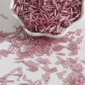 Pink glass bugle beads for DIY jewelry and embroidery scattered from a ceramic bowl - Size 3 Bugle 2x7mm / Pink