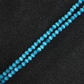 Close-up of light blue cat's eye round beads for DIY jewelry with distinct optical effect - Lake Blue