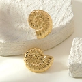 Detailed view of golden spiral nautilus earrings displayed on white textured stones - Conch Stud Style (FYD6230EH)