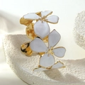 Golden stainless steel open bangle featuring two elegant white enamel flowers on stone - White (FYD6238SZ)