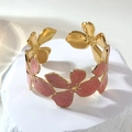 Detail of gold floral cuff with pink enamel petals and textured stone pattern - Rose Red (FYD6238SZ)