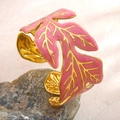 Pink enamel leaf cuff bangle in gold-plated stainless steel with adjustable open design - Pink