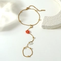 Detail of gold flower finger bracelet with orange and white beads and adjustable chain - White Red Style (BG040-white-red)