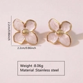 Detailed macro view showing the pink enamel flower earrings with dimensions and weight - White
