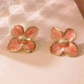 Detail of French vintage flower stud earrings with pink enamel petals and gold plating - Orange