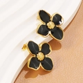 Golden flower earrings with black enamel petals on a minimalist display stand - Stud Earrings Only (FYD6111-black)