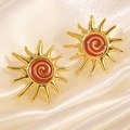 Elegant gold-plated sunburst stud earrings with red enamel spiral on silk background - Red