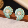 Detailed close-up of shell-shaped earrings with mint green enamel and center pearl - Blue (FYD6150EH-blue)