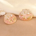 Detailed macro of gold shell earrings with pink enamel, faux pearl, and starfish charms - Red (FYD6172EH-red)