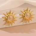Golden sunburst turbine earrings with pink spiral drip oil design for a stylish punk look - White