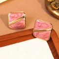 Square gold stainless steel earrings featuring pink marble enamel in a geometric design - Pink