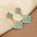 Detail of double diamond geometric earrings with turquoise enamel on champagne silk - Blue