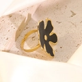 Adjustable golden stainless steel ring featuring a large black enamel flower design - Black