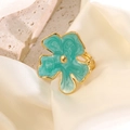 Floral stainless steel ring with green marble enamel and gold finish on silk background - Blue
