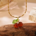 Golden cherry necklace variant featuring deep red beads and translucent green leaf charm - Necklace (LM006) / Red