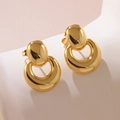 Macro view of gold geometric stud earrings with polished mirror finish and oval design - Oval Crescent Nested Style (FYD6137)