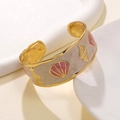 Gold stainless steel C-shaped cuff bracelet with seashell and seahorse enamel charms - Pink