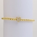 Gold beaded stretch bracelet featuring a micro-pave zircon letter V pendant - Letter V