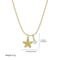 Gold beaded necklace featuring a textured starfish charm and white pearl pendant - Frosted Starfish Design