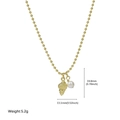 Golden beaded necklace with spiral conch shell pendant and white pearl charm accessory - Nautilus Style