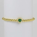 18k gold beaded bracelet featuring a green heart stone centerpiece on white stand - May Bracelet
