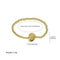Bracelet extensible à billes dorées avec pendentif coquillage et mesures de bijoux - Conque