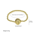 Bracelet en perles de laiton doré orné d'un pendentif coquillage avec fini texturé - Coquillage
