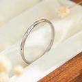 Close-up of a silver titanium steel minimalist ring with geometric faceted texture in a box - Size 5 / Hammered Style (R039) / Steel