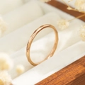 Macro detail showing faceted texture on minimalist rose gold titanium steel ring in jewelry box - Size 5 / Hammered Style (R039) / Rose Gold