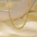 Golden chain necklace featuring turquoise beads and metallic spheres on silk background - Blue and Gold Bead Necklace (H1006) / Gold