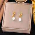 Elegant gold knot earrings with natural white freshwater pearls on jewelry box - Knot Pearl Pendant Style (G3090)