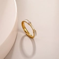 Detail of rose gold titanium ring with white shell inlay and micro-set cubic zirconia - US 7 / Gold with Shell Zirconia