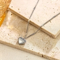 Silver heart pendant necklace with cursive Love engraving on textured stone - Love Engraved Heart Necklace (X1445) / Steel