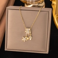 Golden necklace with starfish shell and footprint charms on a brown jewelry stand - Starfish Shell Style (8304)