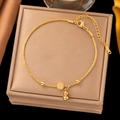 Detail of gold-plated bracelet featuring a Fu charm, gourd pendant and adjustable chain - Blessing Gourd Necklace (H1227) / Gold