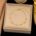 Elegant gold plated clover bracelet featuring adjustable lobster clasp in a jewelry box - Cube Flower Bracelet (E92) / Gold