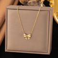 Elegant gold titanium steel necklace featuring a textured bow pendant on a jewelry box - 【h321】bow Necklace Gold