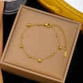 Elegant gold beaded stainless steel bracelet with lobster clasp on a jewelry box - 【e129】small And Large Round Beads; Bracelet; Gold