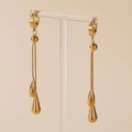 Elegant gold-plated titanium steel water drop tassel earrings on a display stand - Waterdrop Earrings (E108) / Gold