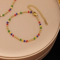 Bracciale in acciaio inossidabile dorato con ciondoli a triangolo colorati - Braccialetto - Oro Perlina in Quattro Colori (E2061)