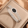 Silver hollow mesh bangle featuring an oval black stone on a premium jewelry display - Steel