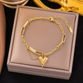 Golden titanium heart pendant bracelet with asymmetrical links and layered chain - 【e69】heart-shaped Bracelet Gold