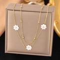 Elegant gold necklace set with white shell flower pendants draped on a jewelry box - 【h1133】double-layer White Daisy Necklace In Gold